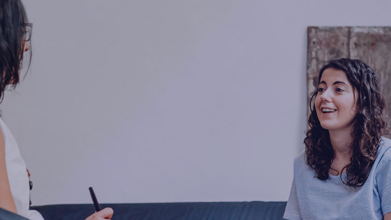Therapy session, woman talking to her therapist in the studio