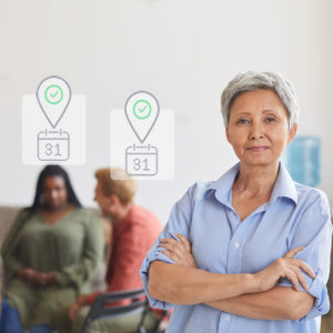 Practitioner standing in front of group meeting